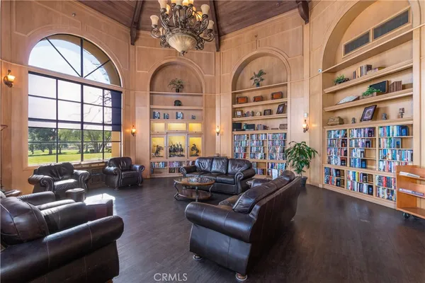 a view of swimming pool with outdoor seating and trees
