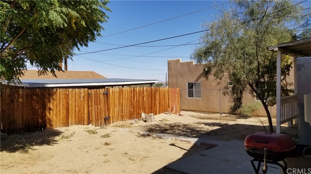 61750 Desert Air Road Joshua Tree, CA 92252 - Photo 18 of 28 a view of a house with a patio
