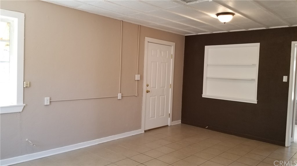 61750 Desert Air Road Joshua Tree, CA 92252 - Photo 5 of 28 a front view of a house with a porch
