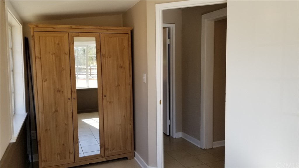 61750 Desert Air Road Joshua Tree, CA 92252 - Photo 9 of 28 a kitchen with stainless steel appliances granite countertop a stove a sink and a microwave