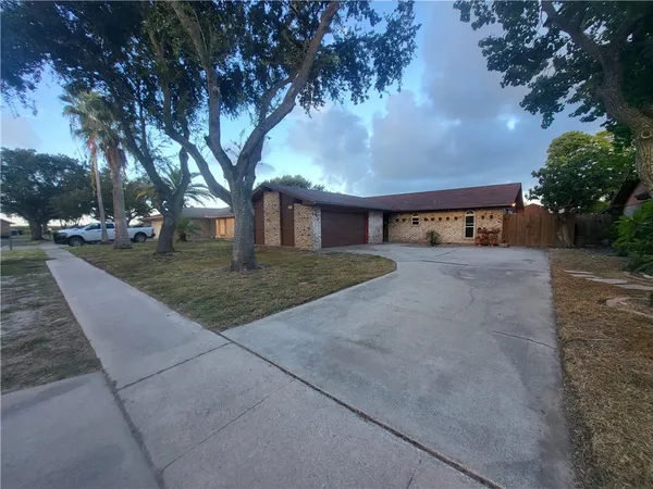a view of swimming pool with trees in the background