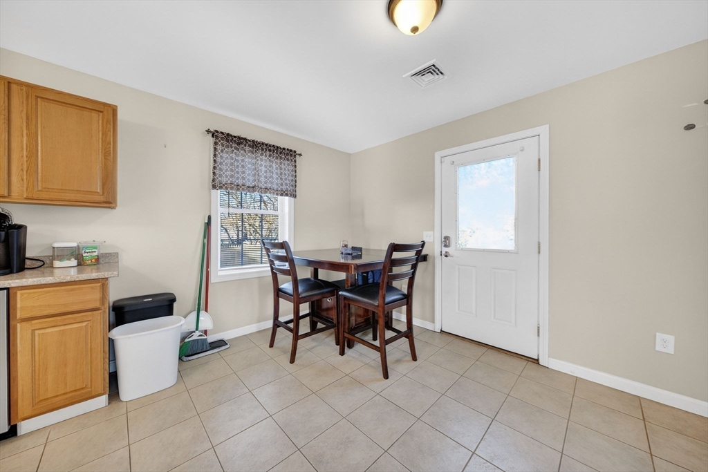 321 King Street Fall River, MA 02724 - Photo 14 of 40 a view of a dining room with furniture and chandelier