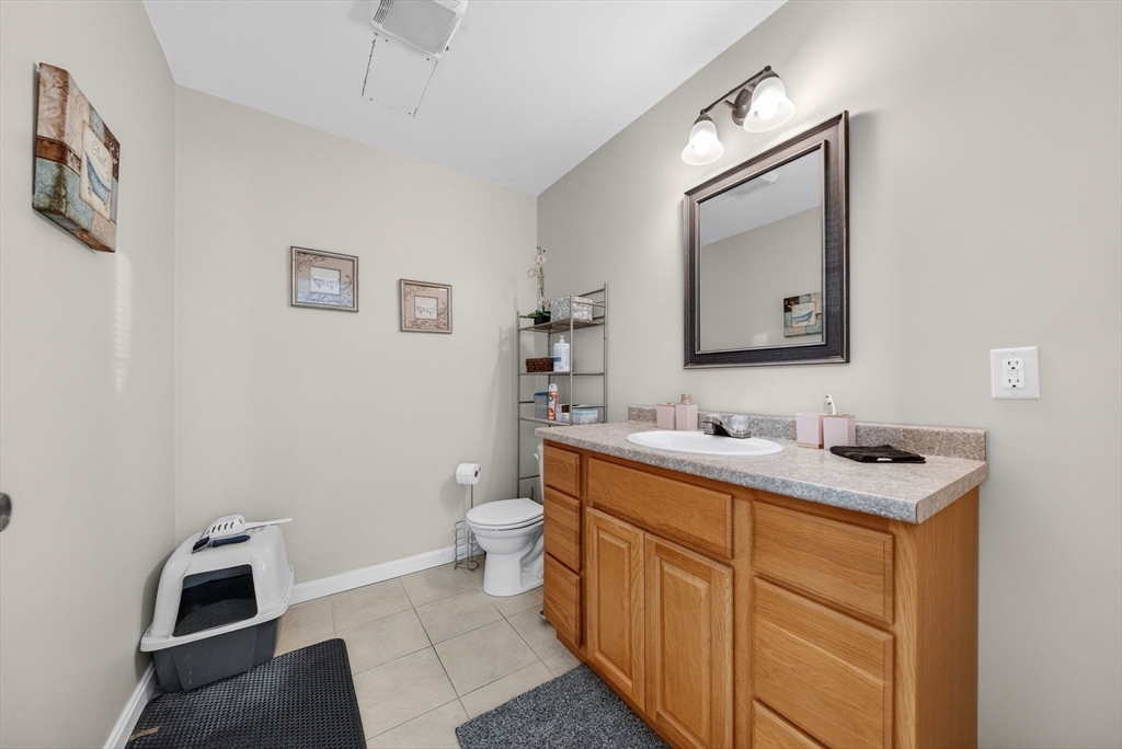 321 King Street Fall River, MA 02724 - Photo 15 of 40 a bathroom with a toilet sink and mirror