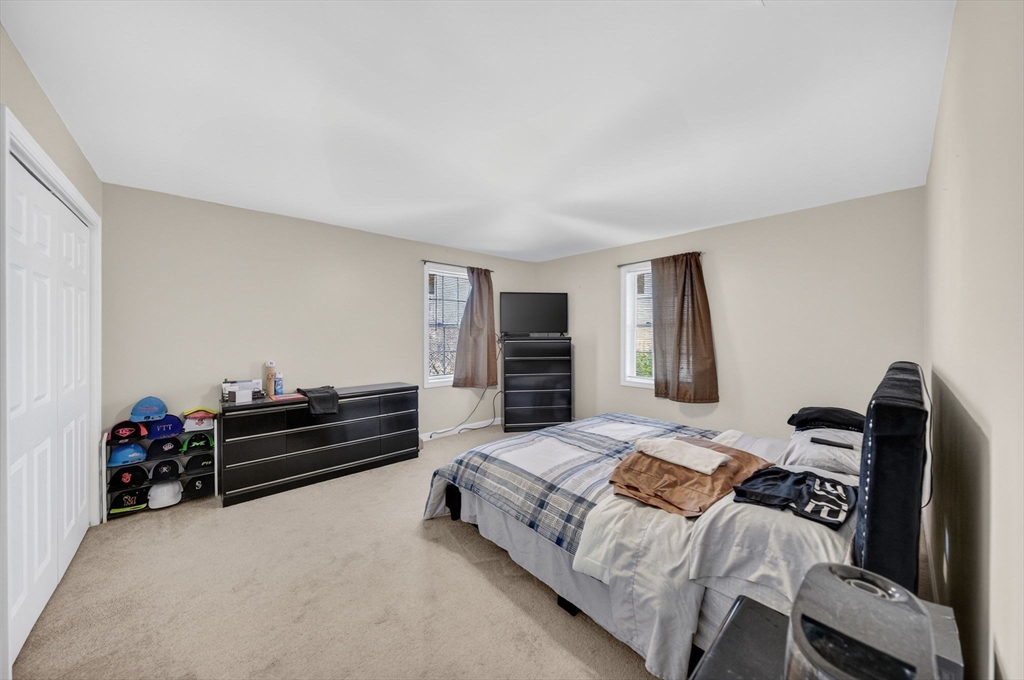 321 King Street Fall River, MA 02724 - Photo 20 of 40 a bedroom with a bed and a couch