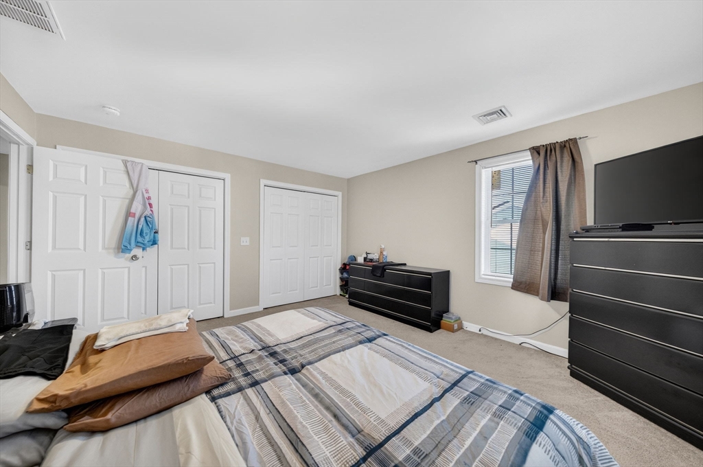 321 King Street Fall River, MA 02724 - Photo 22 of 40 a bedroom with a bed and a television