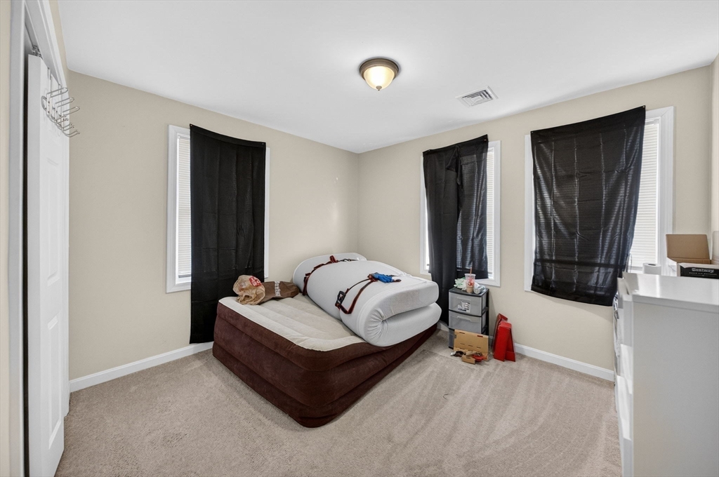 321 King Street Fall River, MA 02724 - Photo 23 of 40 a living room with furniture and a fireplace