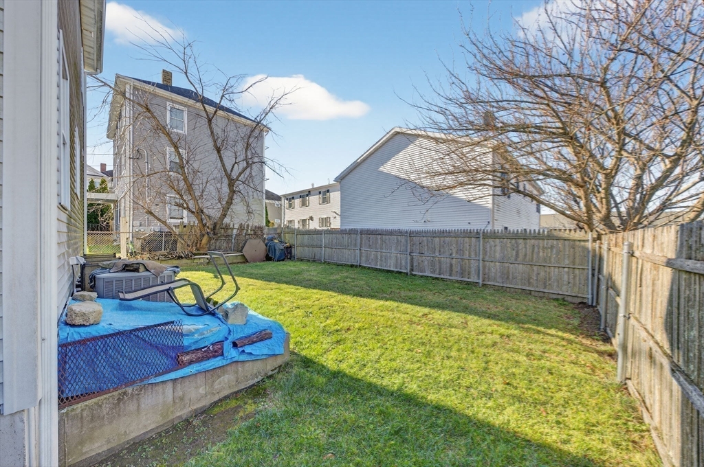 321 King Street Fall River, MA 02724 - Photo 32 of 40 a view of a backyard with a small pool and sitting area