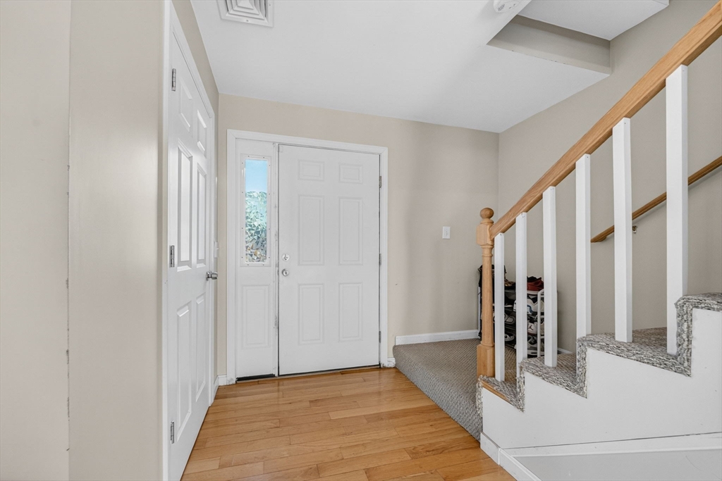 321 King Street Fall River, MA 02724 - Photo 6 of 40 a view of a hallway with wooden floor and staircase