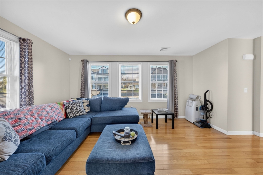 321 King Street Fall River, MA 02724 - Photo 9 of 40 a living room with furniture chess table and a large window