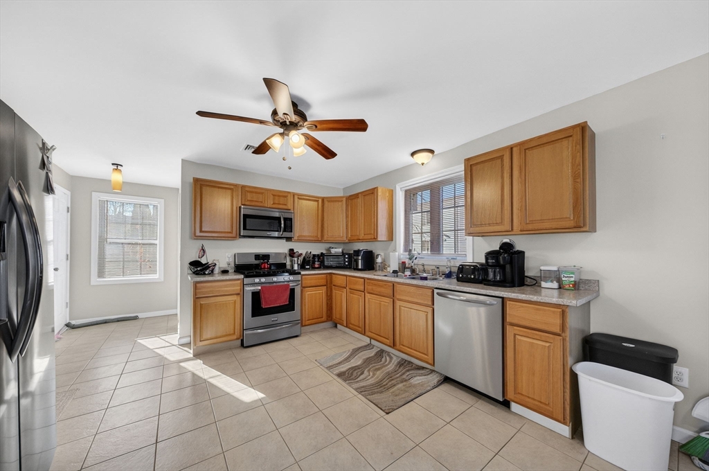 321 King Street Fall River, MA 02724 - Photo 10 of 40 a kitchen with stainless steel appliances granite countertop a sink and cabinets