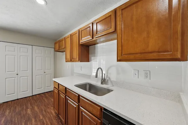 a kitchen with a sink and cabinets