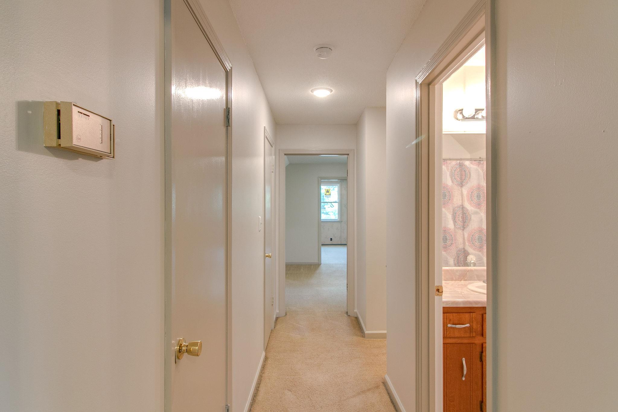 3392 Allen Road Clarksville, TN 37042 - Photo 25 of 27 Upstairs hallway with closets to the left, full bath to the right and a bedroom beyond.