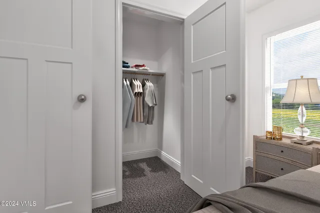 a room with two washing machine with mirror