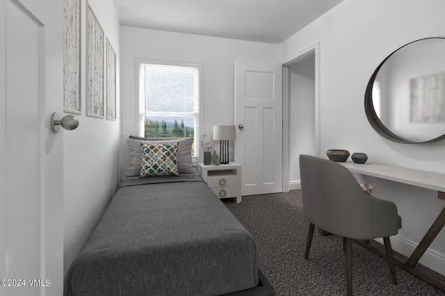 a balcony with table and chairs