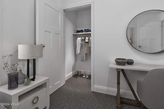 a view of a hallway with workspace