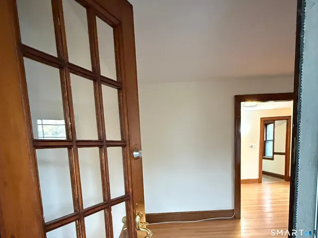 a view of an entryway with wooden floor