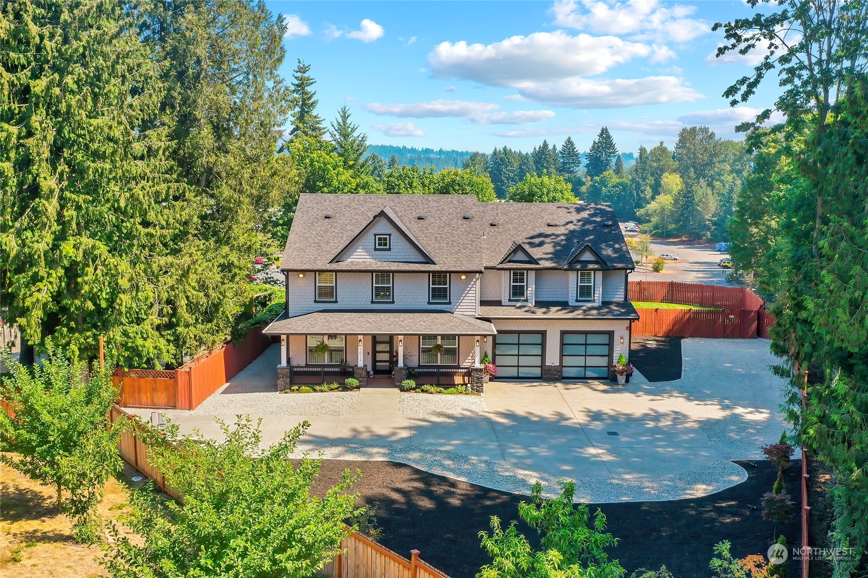 1012 219th Place Southeast Bothell, WA 98021 - Photo 1 of 1 an aerial view of a house with a garden