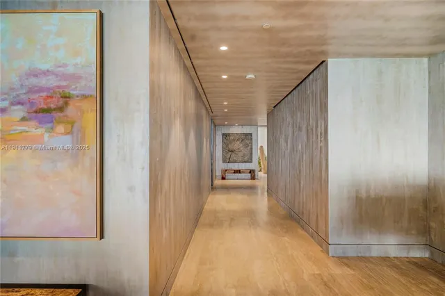 a dining room with furniture and a floor to ceiling window