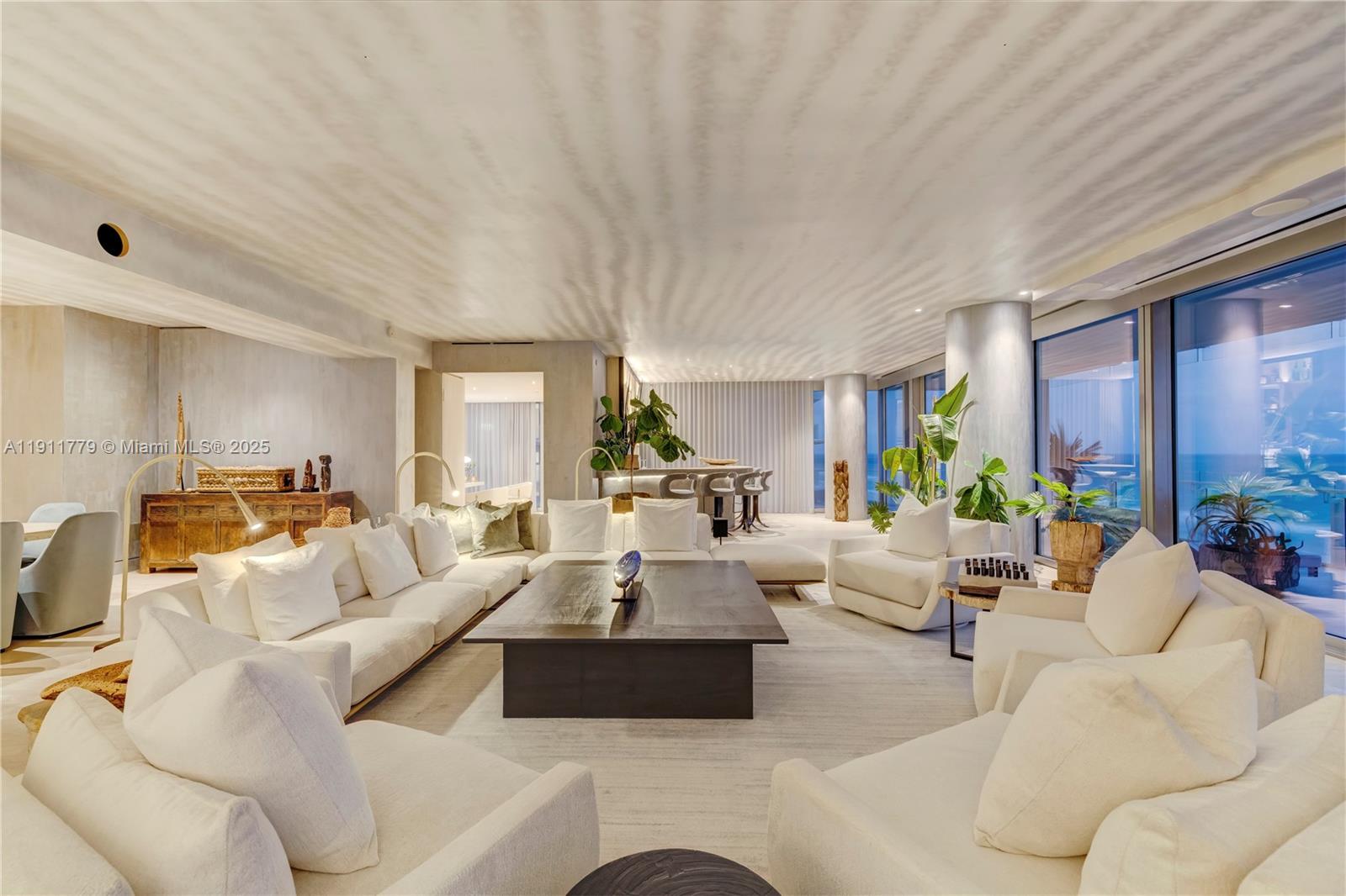 9111 Collins Avenue, Unit N721 Surfside, FL 33154 - Photo 20 of 52 a living room with furniture and a large window