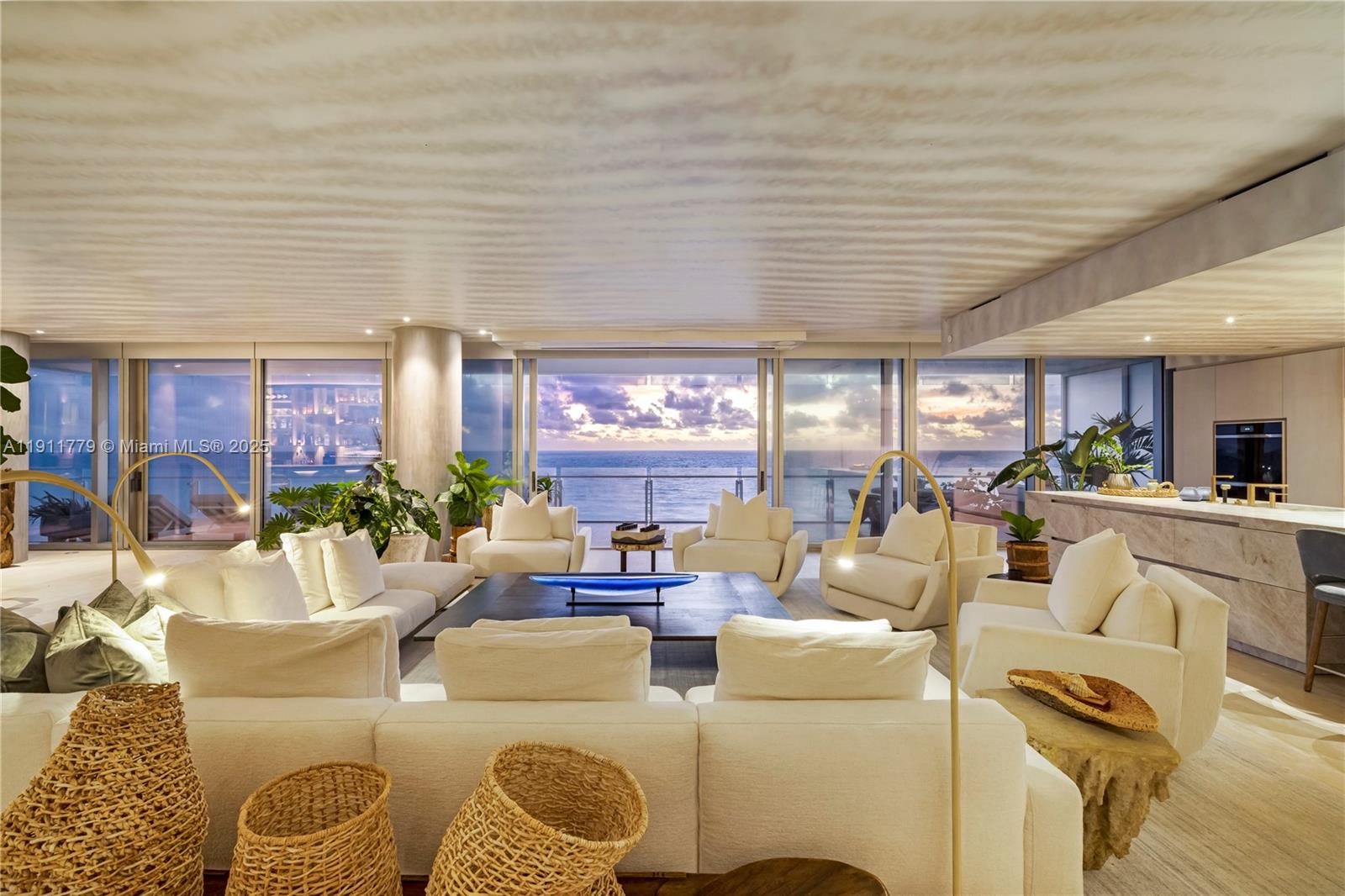 9111 Collins Avenue, Unit N721 Surfside, FL 33154 - Photo 23 of 52 a living room with furniture and a large window