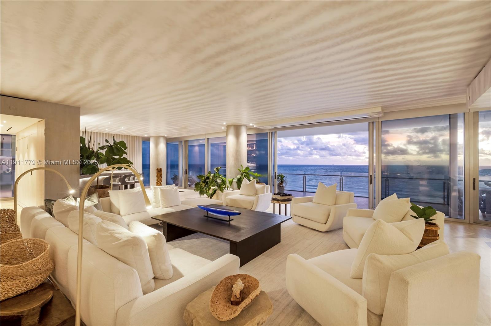 9111 Collins Avenue, Unit N721 Surfside, FL 33154 - Photo 24 of 52 a living room with furniture and a large window