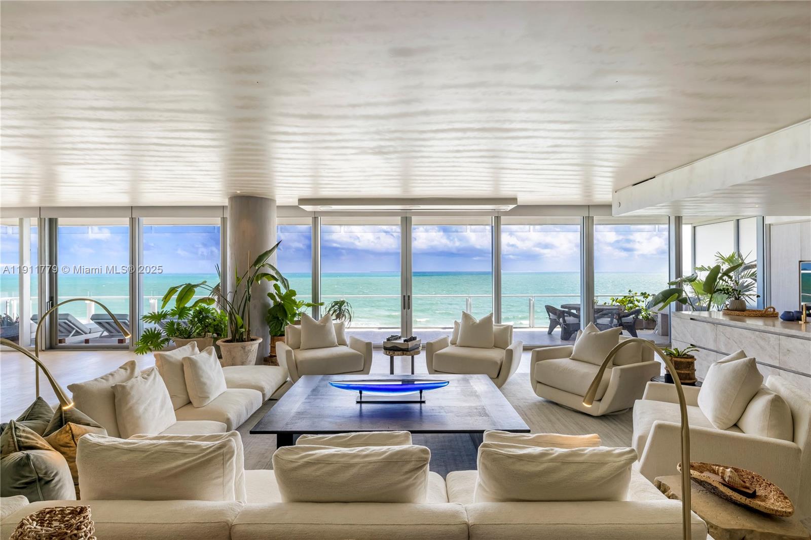 9111 Collins Avenue, Unit N721 Surfside, FL 33154 - Photo 4 of 52 a living room with furniture and a large window