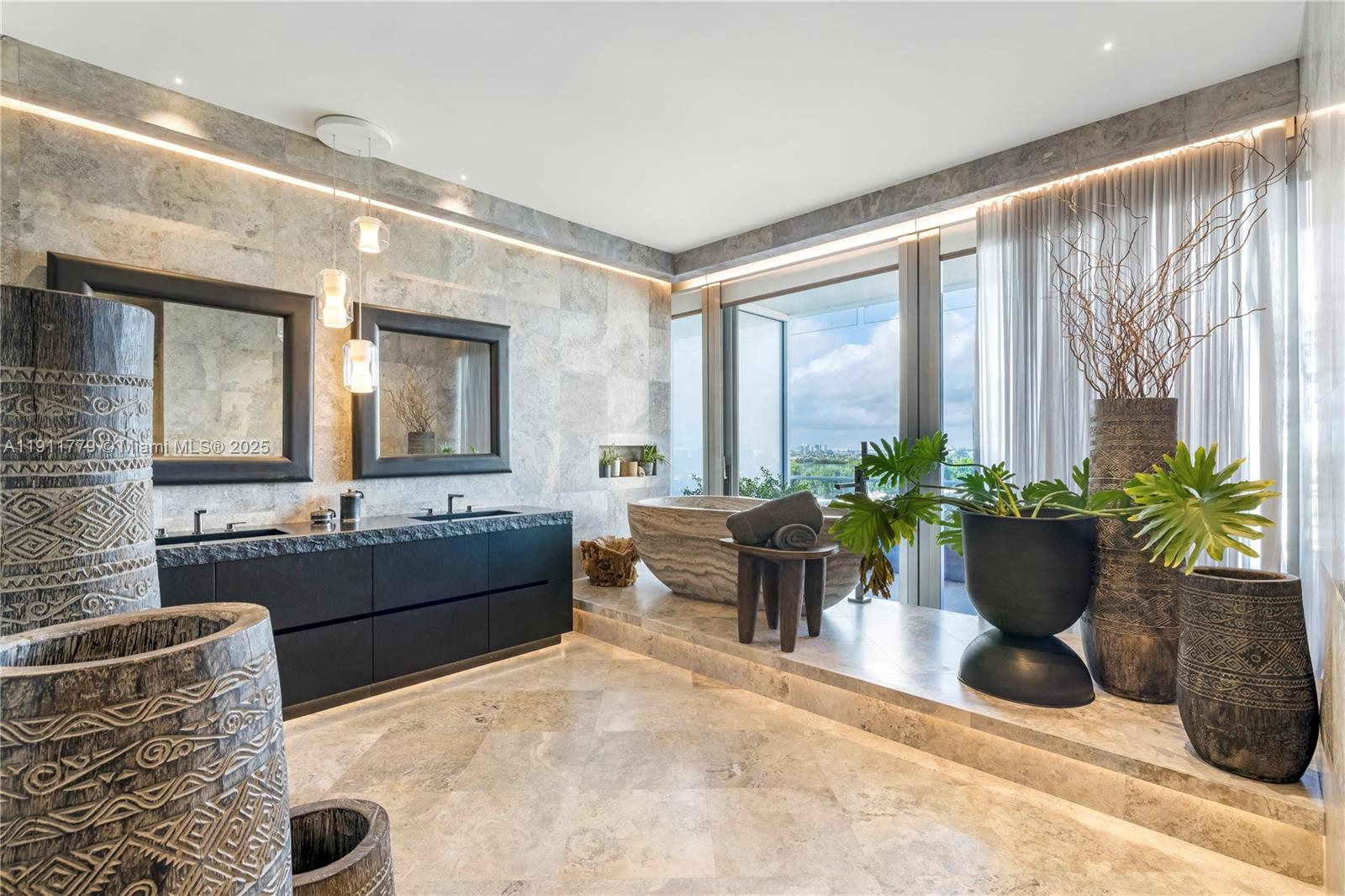 9111 Collins Avenue, Unit N721 Surfside, FL 33154 - Photo 48 of 52 a living room with furniture potted plant and a large window