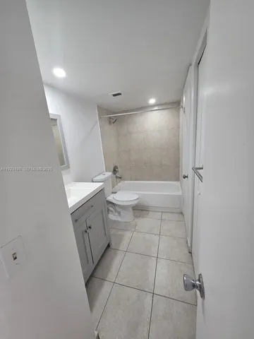 a view of a room with a large window