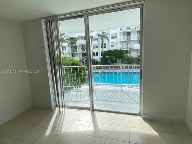 a view of balcony with wooden floor