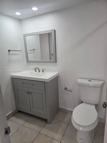 a bathroom with a sink a toilet and a bathtub