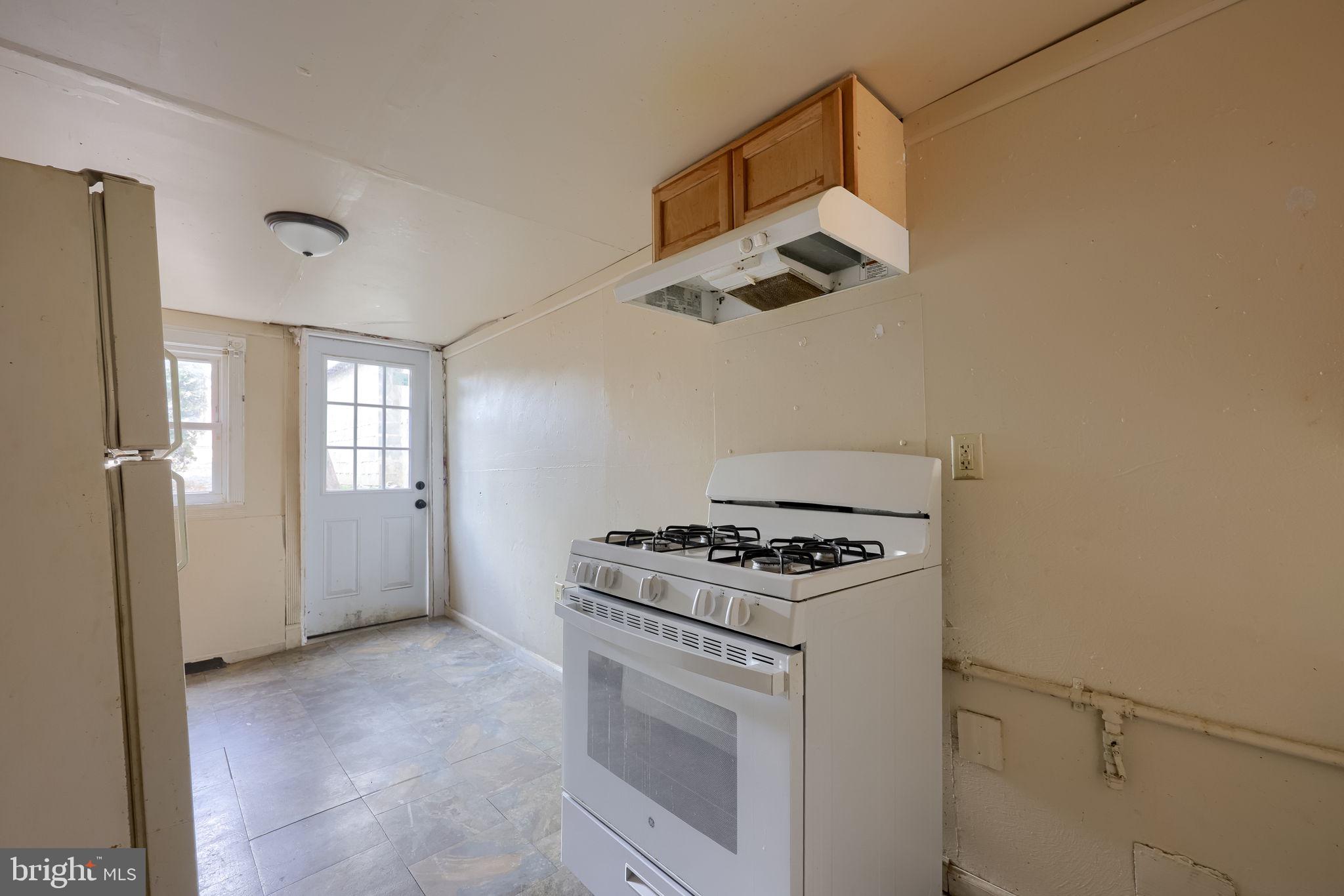 519 South Prince Street Lancaster, PA 17603 - Photo 12 of 15 a kitchen with a stove and a microwave