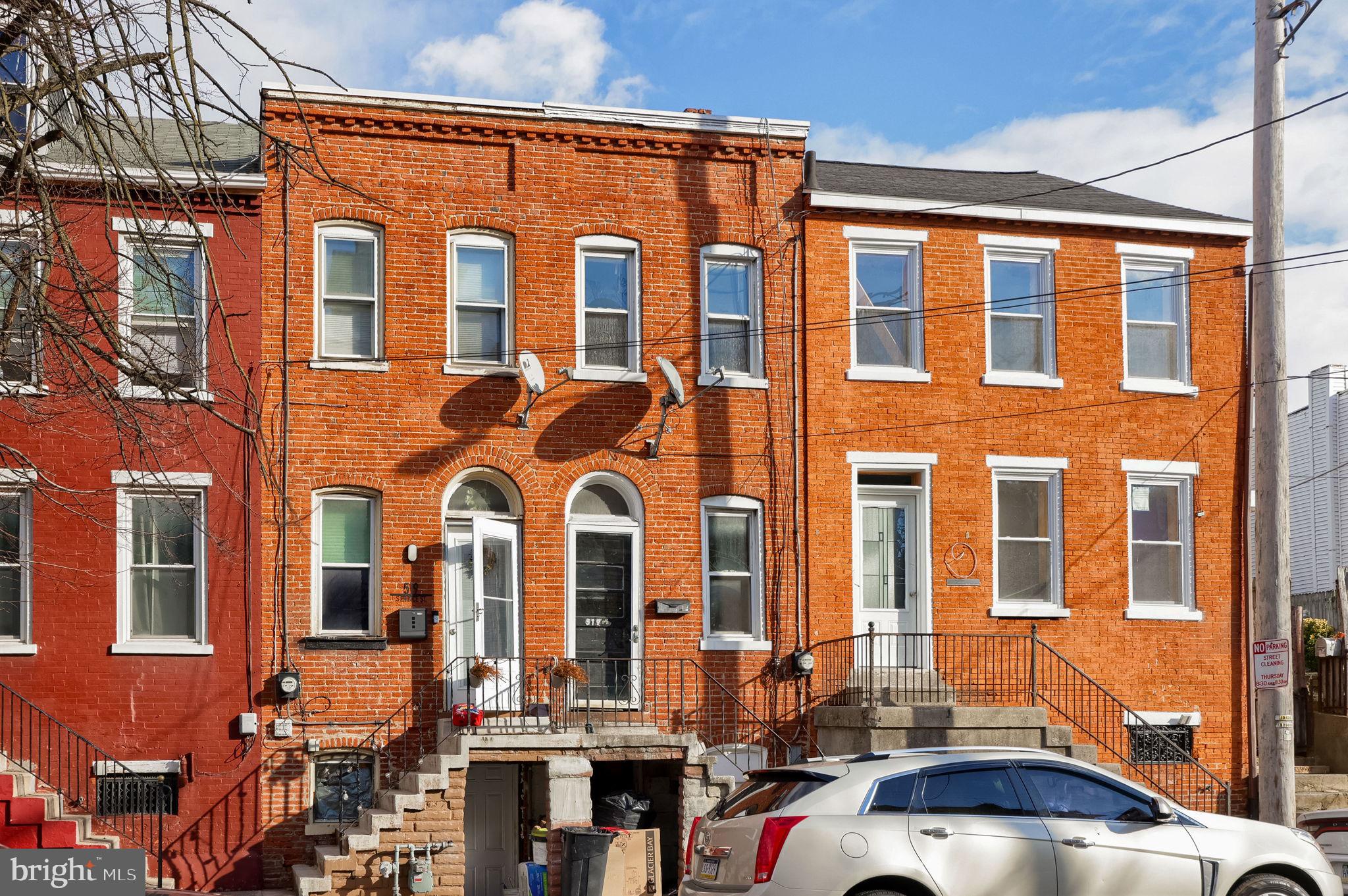 519 South Prince Street Lancaster, PA 17603 - Photo 3 of 15 a front view of a residential apartment building with a yard