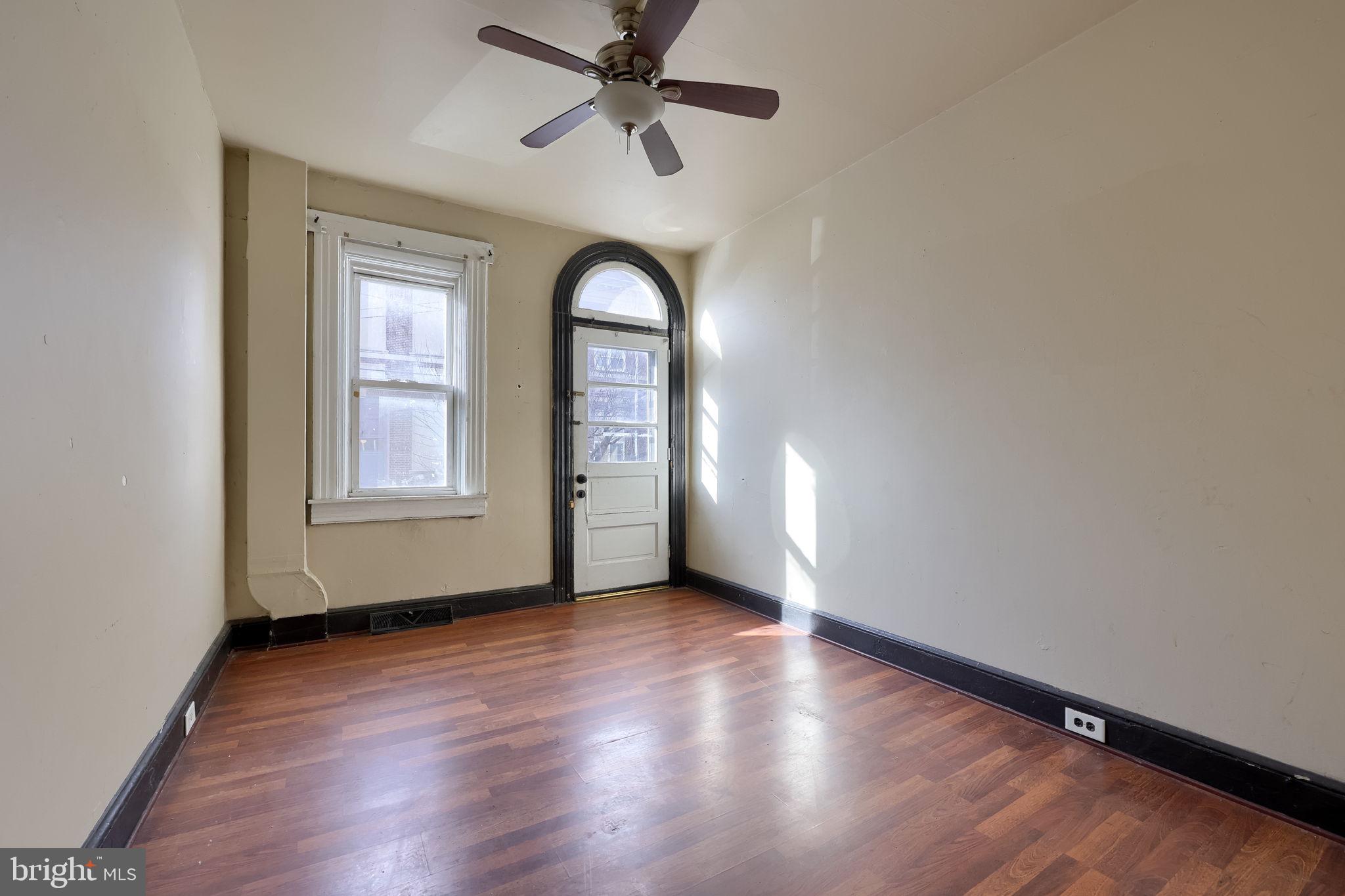 519 South Prince Street Lancaster, PA 17603 - Photo 5 of 15 an empty room with wooden floor closet and windows