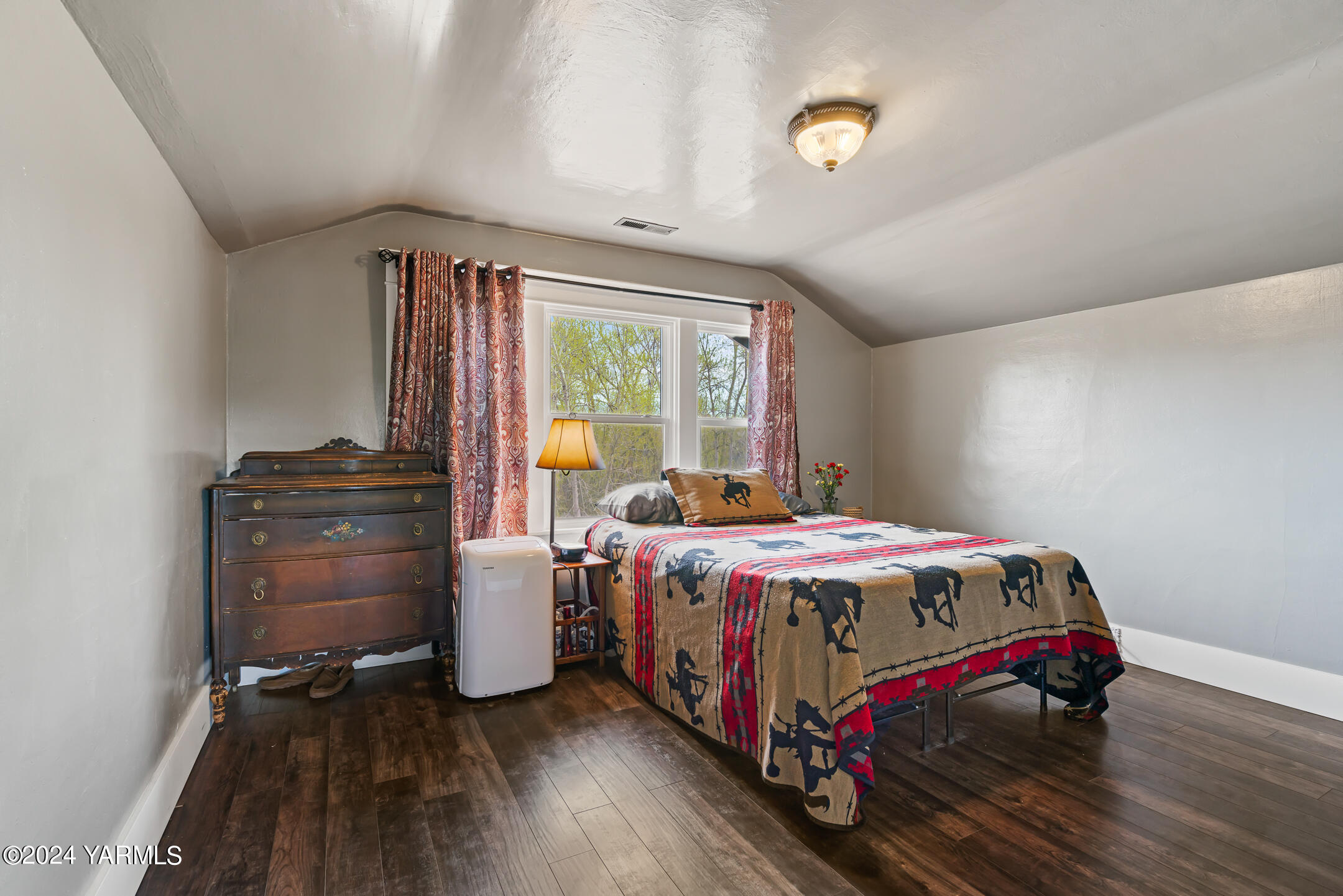 17970 Ahtanum Road Yakima, WA 98903 - Photo 16 of 27 a bedroom with a bed and wooden floor