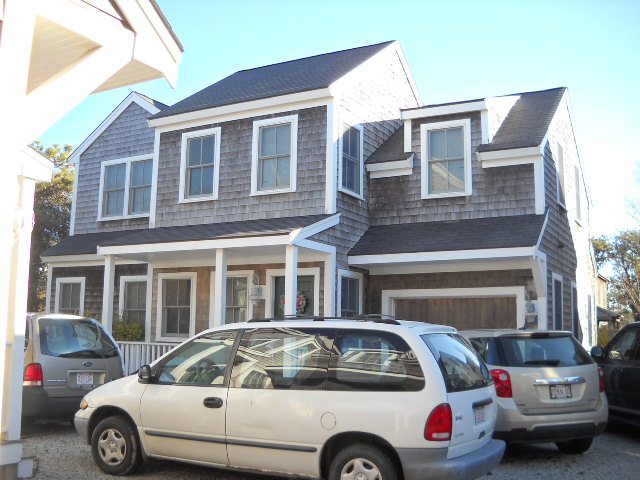 20 Nobadeer Farm Road, Unit EACH Nantucket, MA 02554 - Photo 4 of 10 a car parked in front of a house