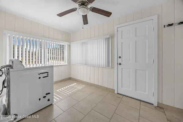 a kitchen with a table chairs and a dining table