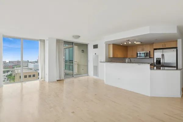a view of a kitchen with a sink and cabinets