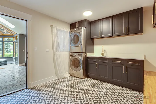a large kitchen with a large counter top appliances and cabinets