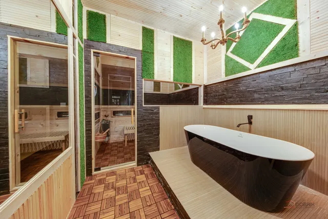 a bathroom with a granite countertop sink and mirror