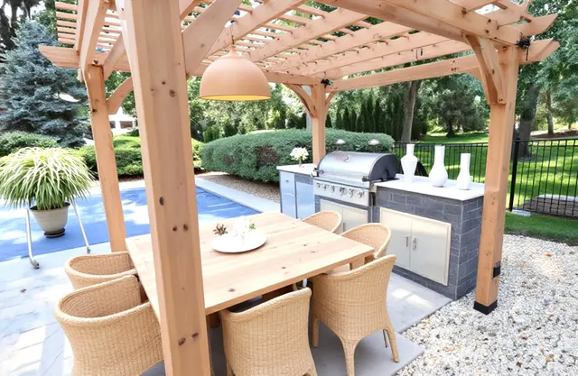 a view of a patio with a table chairs and a backyard