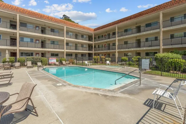 a view of a building with a swimming pool