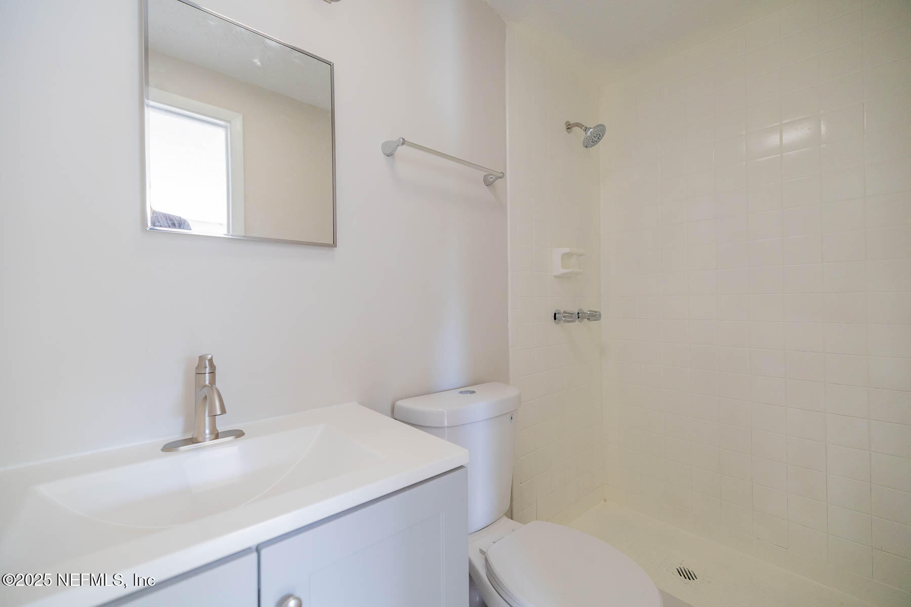 9626 Spottswood Road West Jacksonville, FL 32208 - Photo 11 of 16 a bathroom with a sink toilet and vanity