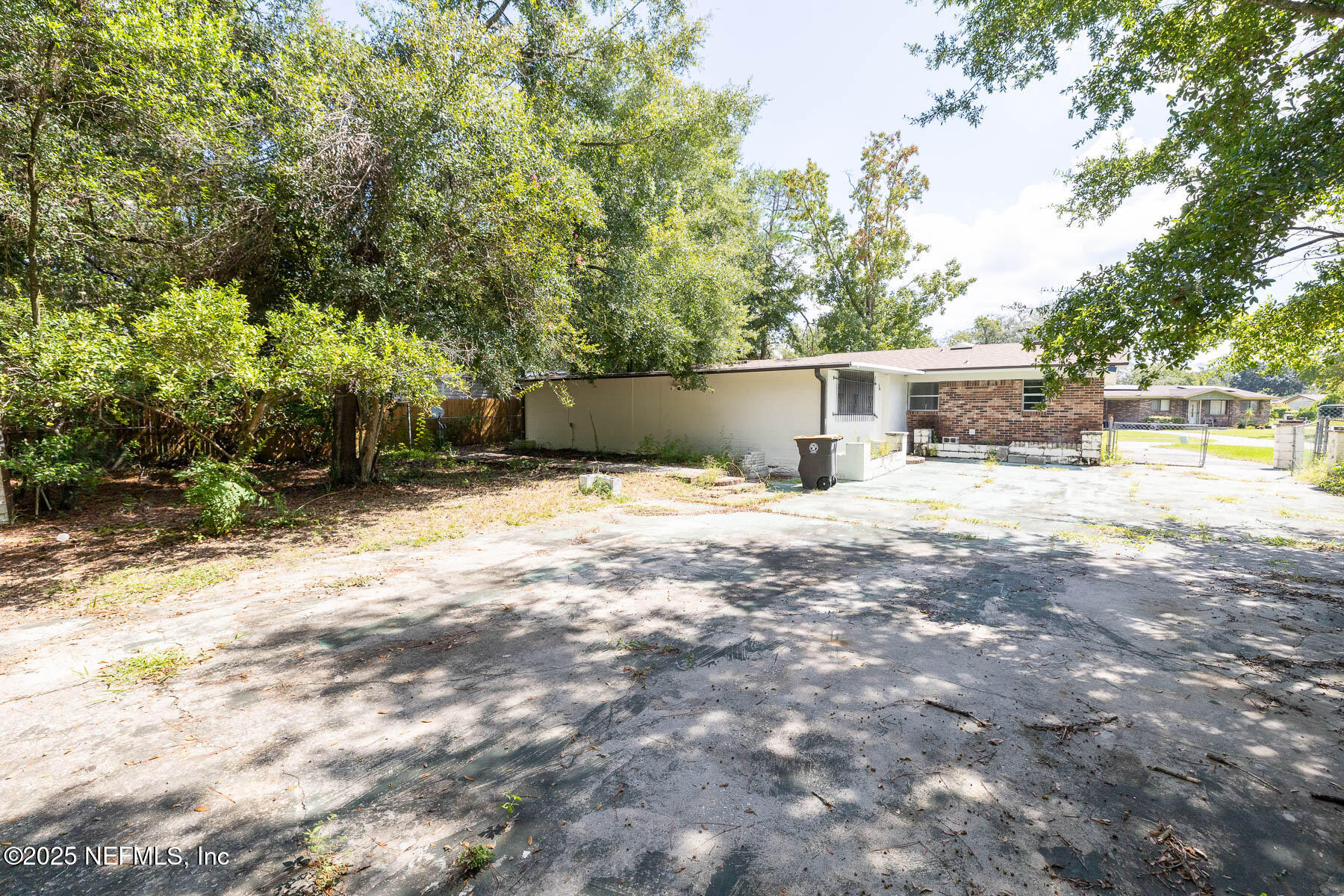 9626 Spottswood Road West Jacksonville, FL 32208 - Photo 16 of 16 a view of a house with backyard and sitting area