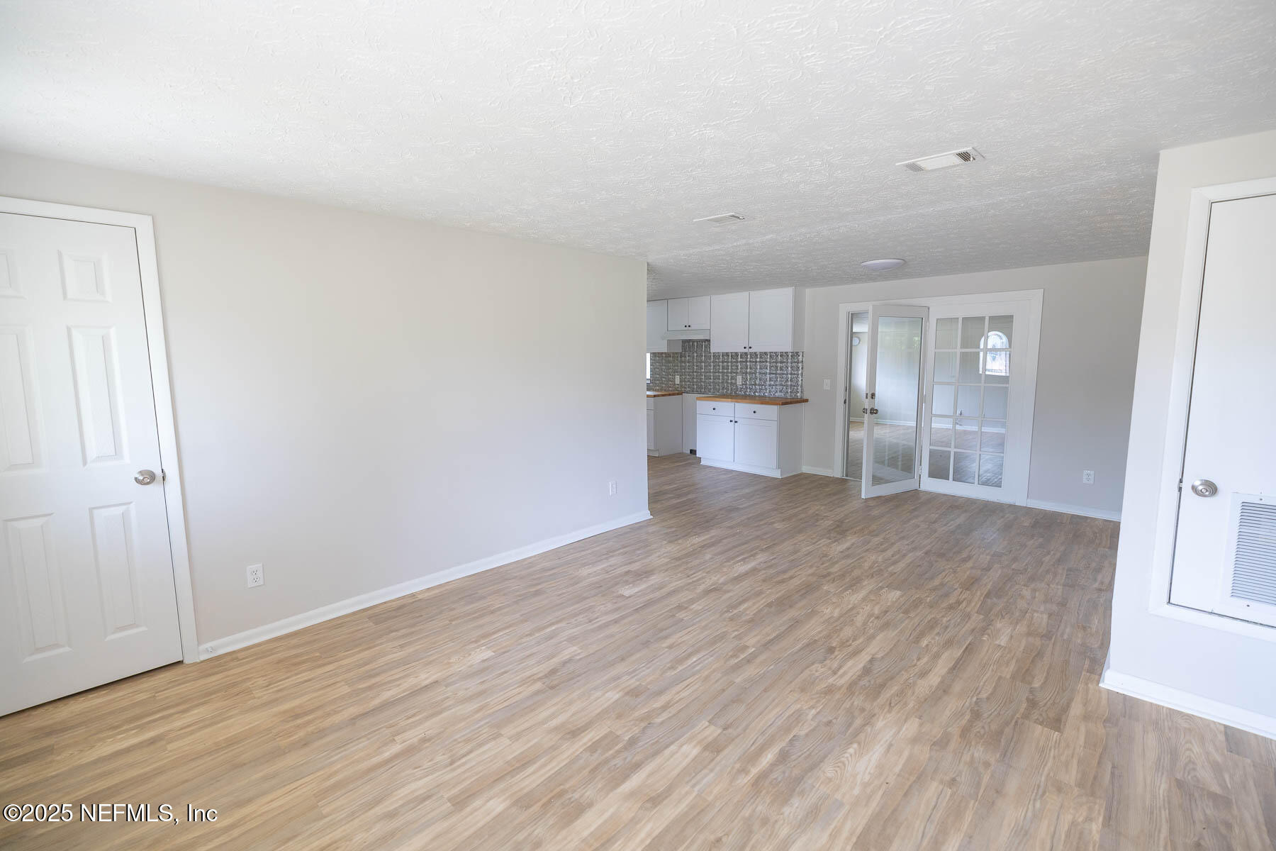 9626 Spottswood Road West Jacksonville, FL 32208 - Photo 3 of 16 a view of empty room with wooden floor