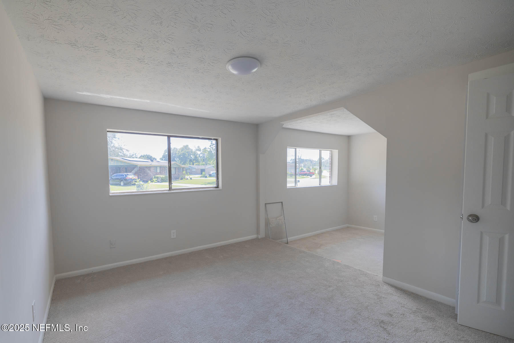 9626 Spottswood Road West Jacksonville, FL 32208 - Photo 9 of 16 an empty room with windows