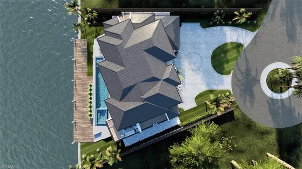 a swimming pool view with a seating space and a garden view