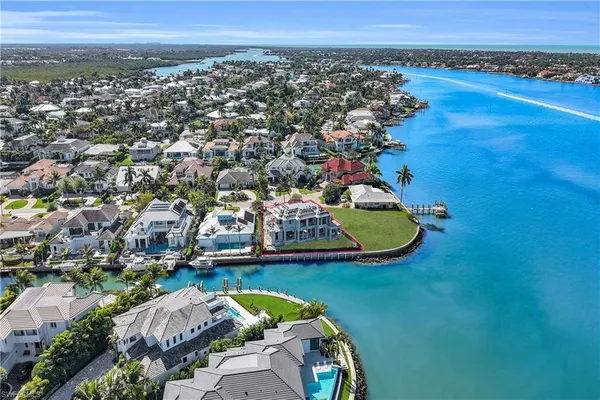 an aerial view of a house with a swimming pool outdoor seating and entertaining space