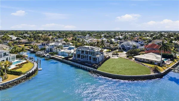 an aerial view of a house with a ocean view