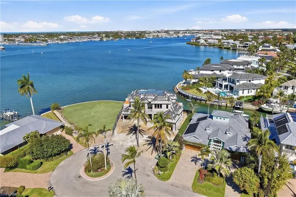 an aerial view of a house with a ocean view
