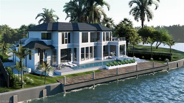 a living room with furniture and floor to ceiling windows